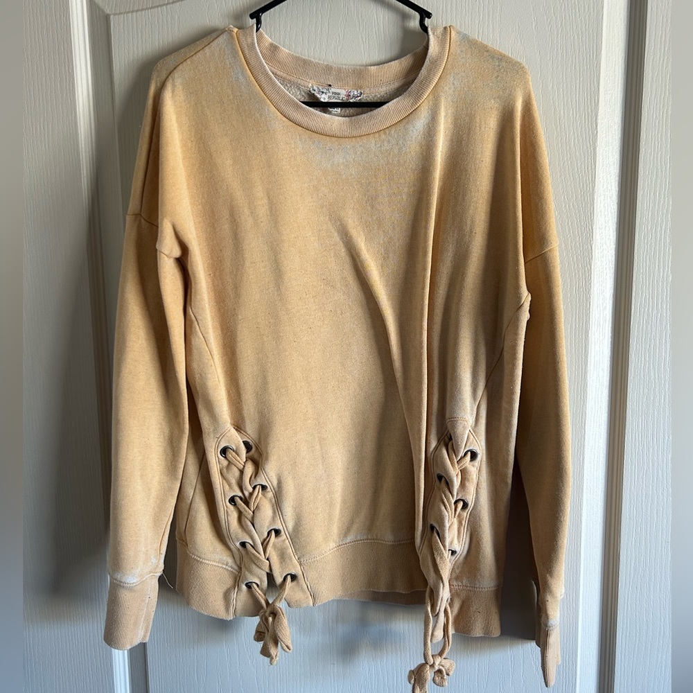 yellow sweater with braided details